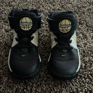 Nike Team Hustle Kids Sneakers - Black, White, and Gold